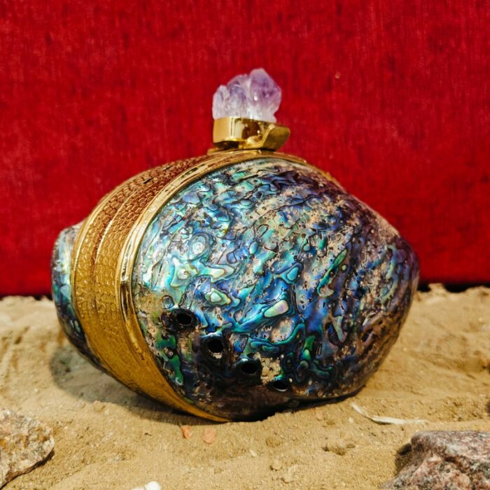 Angle view of paua Seashell handbag with amethyst knob