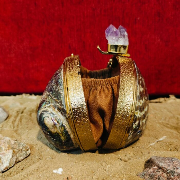 Side open view of paua Seashell handbag with amethyst knob