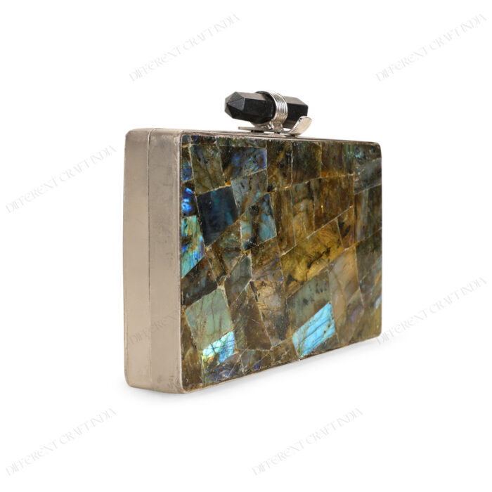 Angle view of Natural labradorite gemstone clutch with quartz crystal knob and silver brass frame