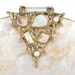 Closeup of White Half-Moon Mother-of-Pearl Clutch Purse with Gold Gemstone-Embellished Triangular