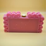 Stylish Resin Pink Ring Clutch with Marble-Like Finish, Adorned with 24 Exquisite Rings