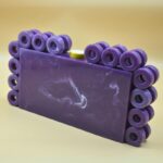 Stylish Resin Purple Ring Clutch with Marble-Like Finish, Adorned with 24 Exquisite Rings