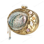 Angle view of Gemstone-Embellished Paua Abalone Seashell Clutch with Gold Frame & Metal Chain Accent