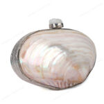 Angle view of Iridescent White Double-Sided Pearl Clam Shell Evening Bag with Silver Metal Frame