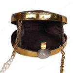 Open view of Mini Iridescent Double-Sided Round Black-Lip Oyster Seashell Bag showcasing the suede lining interior, gemstone knob and chain strap