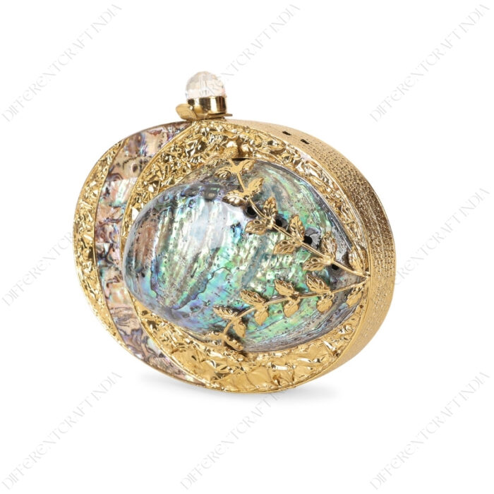 Angle view of Gold Floral Emabellished Iridescent Clutch Shell with Golden Leaves on the Abalone Seashell