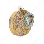 Angle view of Gold Floral Embellished Iridescent Clutch Shell