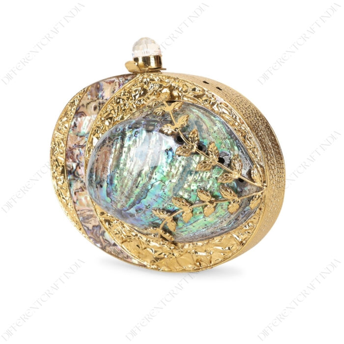 Angle view of Gold Floral Emabellished Iridescent Clutch Shell with Golden Leaves on the Abalone Seashell