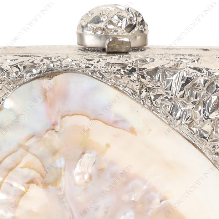 Closeup view of Silver Crumpled Embellished Purse Shell with the irridescent nature of Inside-Out Mother-of-Pearl Clam Seashell