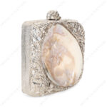 Angle view of Silver Crumpled Embellished Purse Shell with Real Inside-Out Mother-of-Pearl Clam Seashell