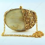 Front View of Pearlescent Clam Seashell Evening Bag with Gold-Toned Wirework, Pearl Knob and metallic chain strap