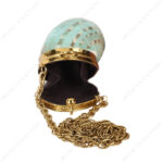 Opne view of Mini Iridescent Green Turban Coin Shell Clutch Purse showcasing the suede lining interior with Gold-Toned Metallic Cap and metal chain