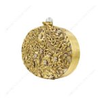 Angle view of Gold Floral Clutch Adorned with Filigree and Pearl Accents on Mother-of-Pearl