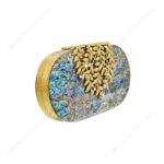 Angle view of Abalone Mother-of-Pearl Clutch with Ornate Gold-Tone Floral Clasp and Pearl Accents