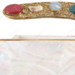 Closeup of White Mother-of-Pearl Clutch with Colorful Gemstone-Studded Gold-Tone Curved Handle