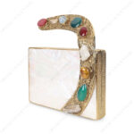 Angle view of White Mother-of-Pearl Clutch with Colorful Gemstone-Studded Gold-Tone Curved Handle