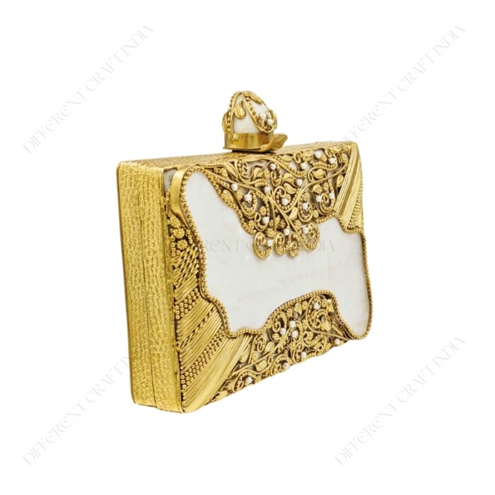 Angle view of Gold Embellished White Mother-of-Pearl Filigree Clutch with Floral Detailing