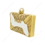 Angle view of Gold Embellished White Mother-of-Pearl Filigree Clutch with Floral Detailing