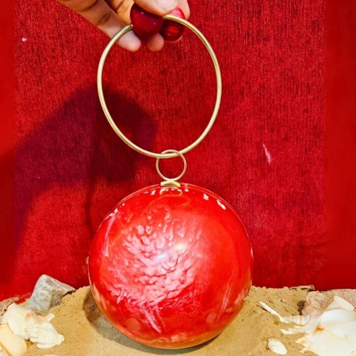 Round Red Resin Ball Clutch with Gold-Tone Circular Metal Handle for a Statement Look