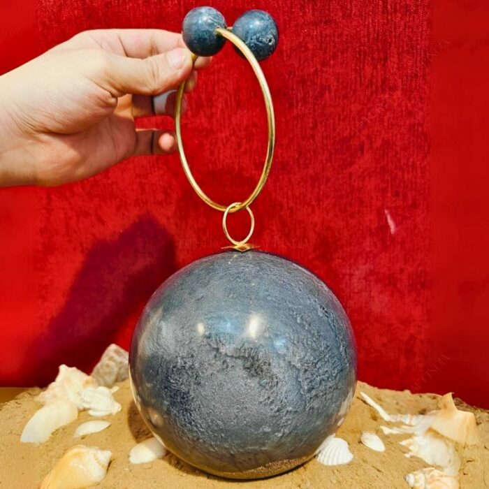 Round Grey Resin Ball Clutch with Gold-Tone Circular Metal Handle for a Statement Look