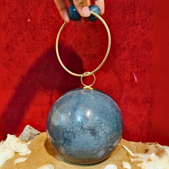 Round Grey Resin Ball Clutch with Gold-Tone Circular Metal Handle for a Statement Look