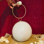 Round White Resin Ball Clutch with Gold-Tone Circular Metal Handle for a Statement Look